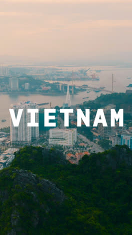 Vertical-Video-Drone-Shot-Of-Vietnamese-Coastal-Port-City-Scene-Overlaid-With-Animated-Graphic-Spelling-Out-Vietnam